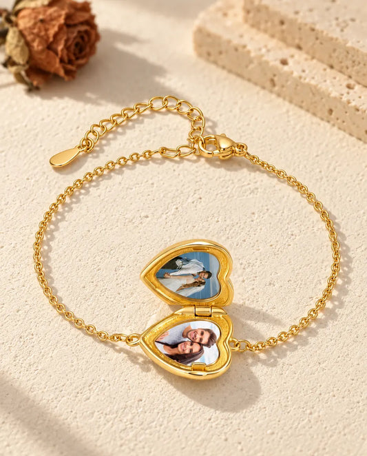 Heart locket bracelet open, with two photos inside