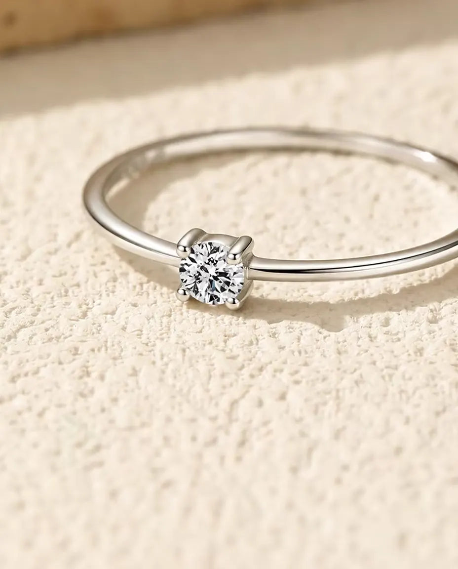 Dainty Moissanite Solitaire Ring in 925 Sterling Silver - close-up of the four-prong moissanite