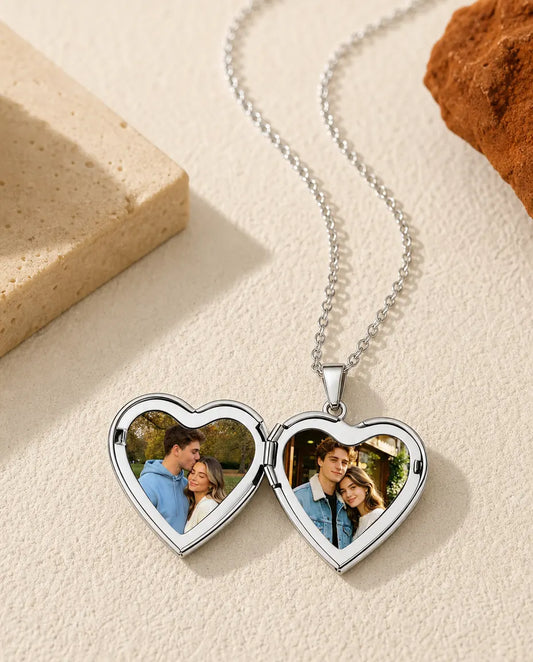 Silver heart locket necklace open showing two heart-shaped photo frames inside