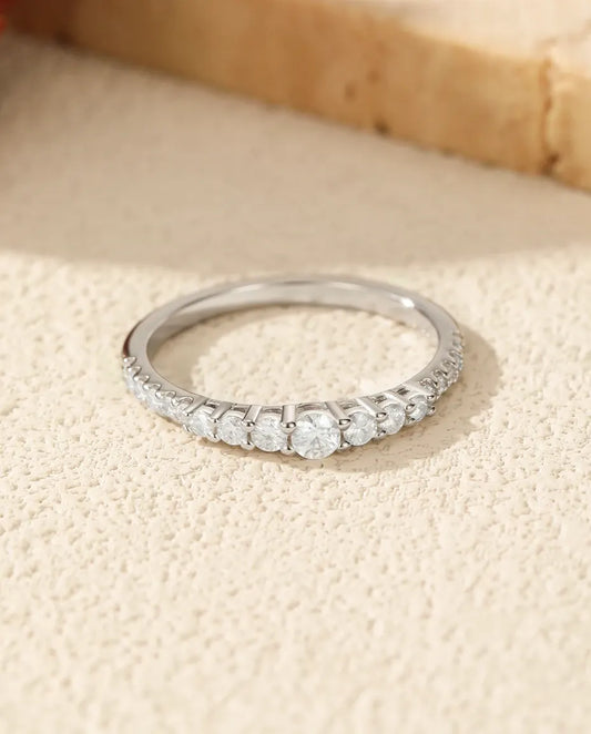 Graduated moissanite wedding band in 925 sterling silver with 19 round D colour stones