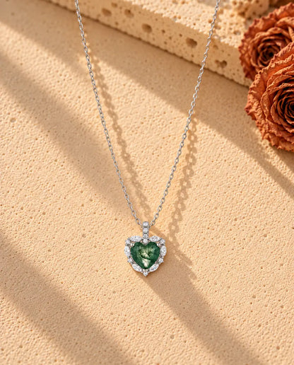 Heart Moss Agate Halo Necklace in 925 Sterling Silver - the whole necklace laid out in a long V on a cream textured surface