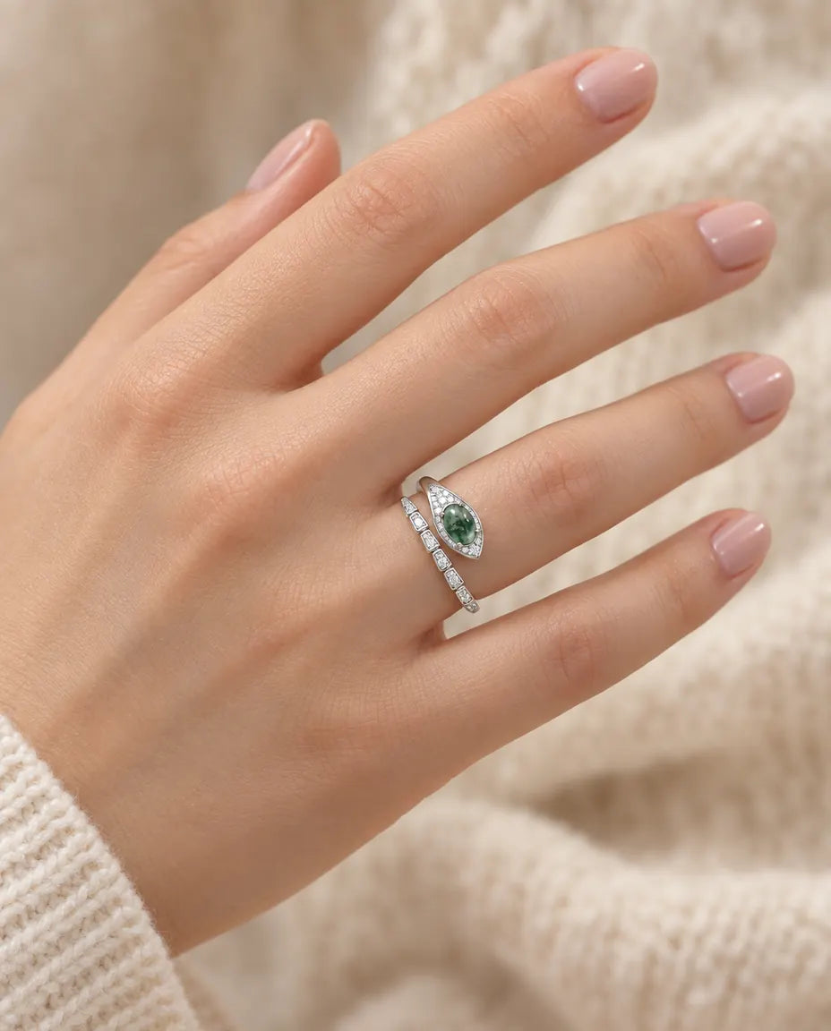 Moss Agate Snake Ring in 925 Sterling Silver - worn on a model’s finger, close-up