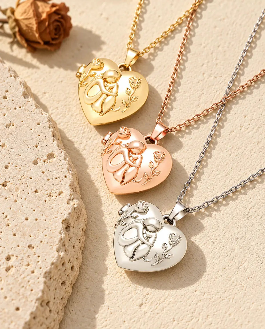 Gold tone, rose gold tone and silver tone dog lover heart photo lockets stacked beside a travertine slab