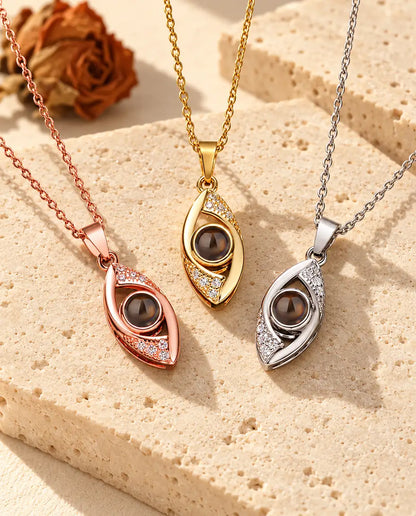Rose gold tone, gold tone and silver tone almond eye pendants side by side