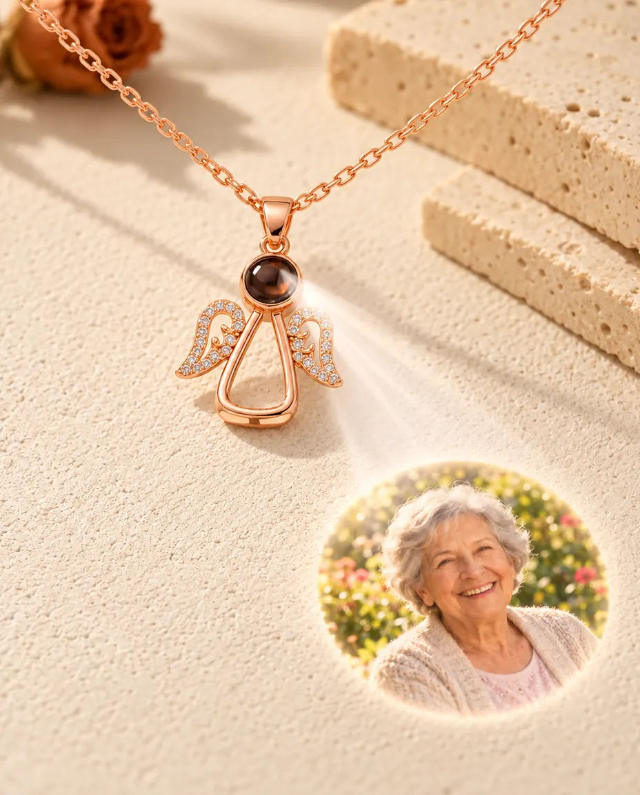 Rose gold tone angel necklace projecting a grandmother's portrait onto cream plaster