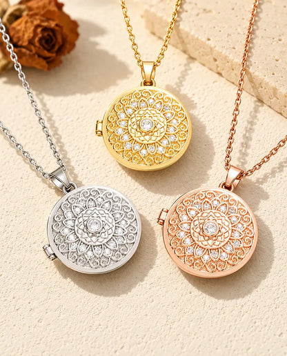 Three colours of the mandala flower photo locket necklace arranged on plaster
