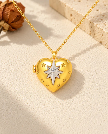 Front view of the gold tone north star heart photo locket showing the lid design and side hinge
