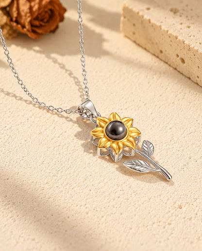Personalised 925 sterling silver sunflower photo projection necklace with gold tone petals on cream plaster