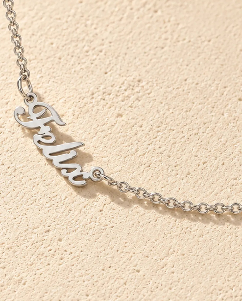Personalised Two Name Necklace in 925 Sterling Silver - Two Script Nameplates Joined by Chain - close-up of the cut-out name