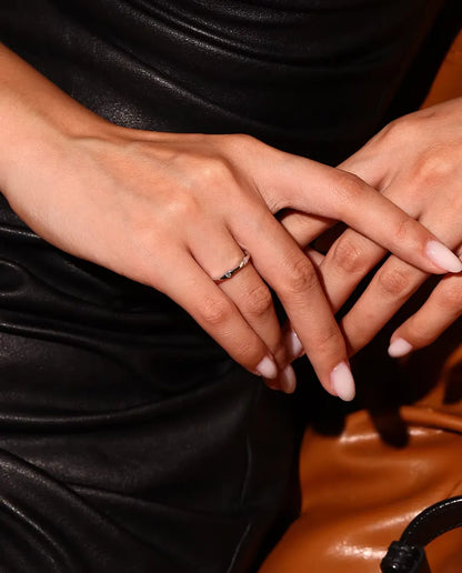 Wavy Moissanite Band Ring in 925 Sterling Silver - worn on a model with hands crossed